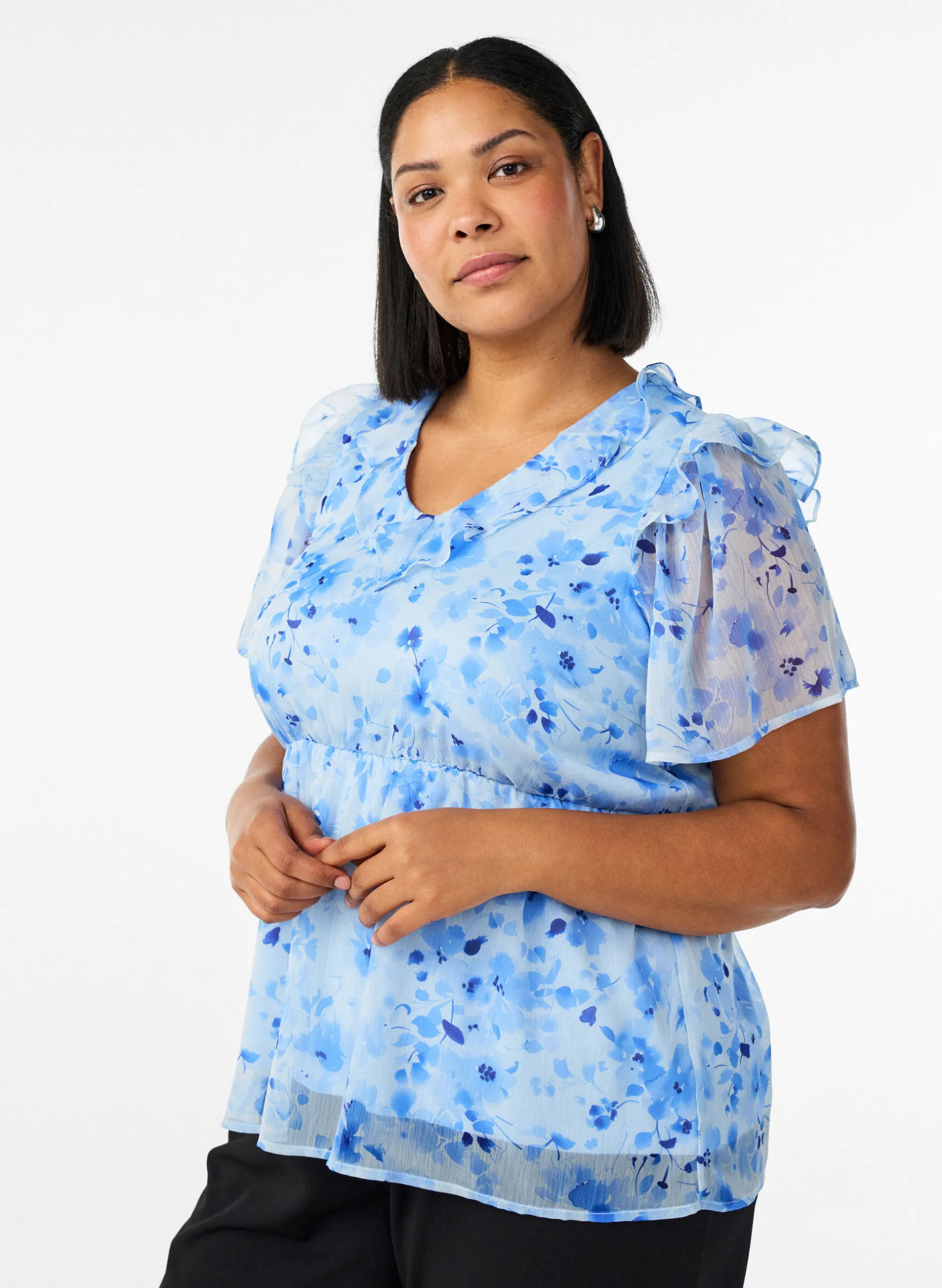 Geblümte Bluse mit Rüschenkragen und Peplum-Effekt