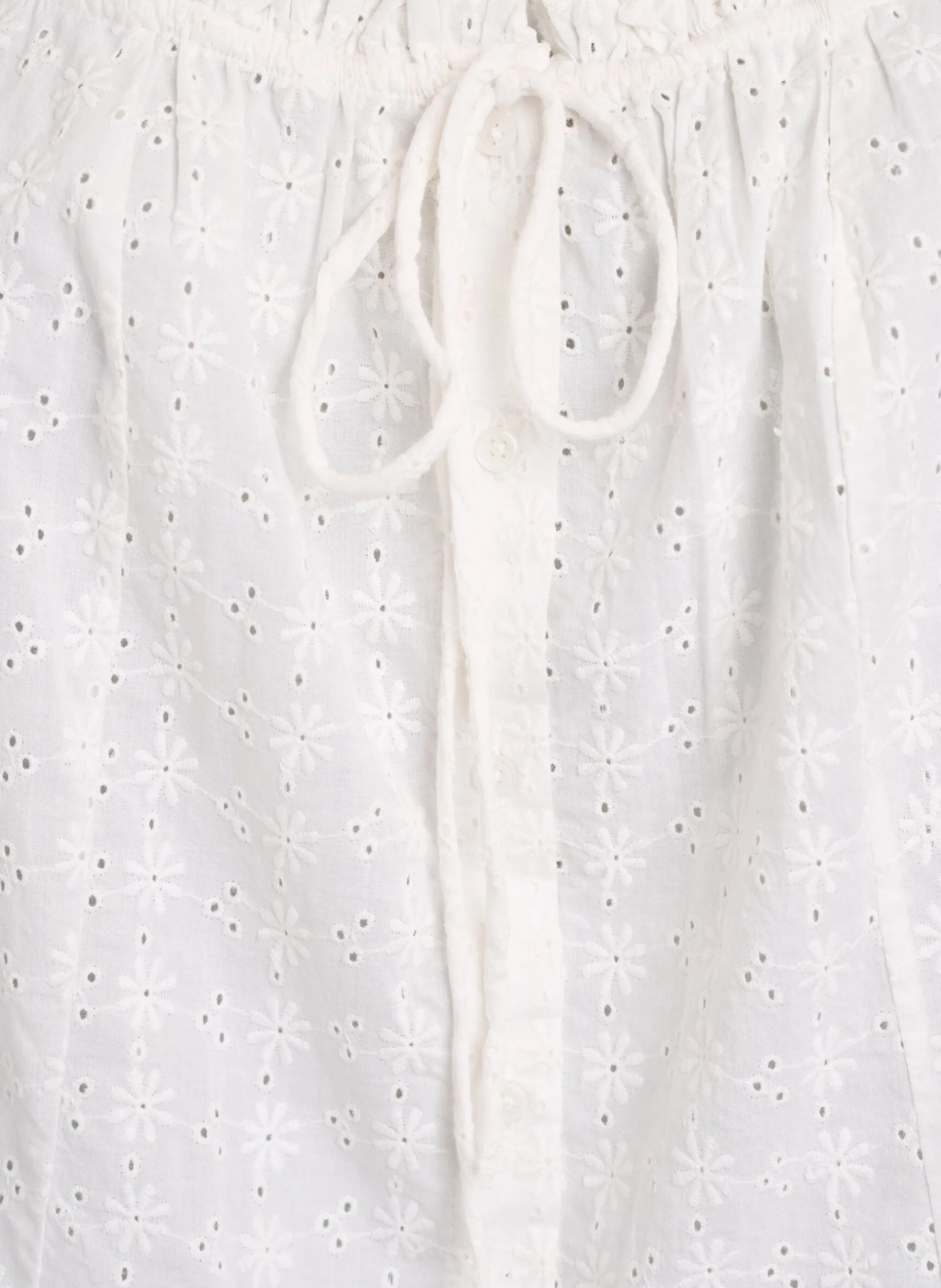 Ärmellose Bluse mit Lochstickerei und Rüschen